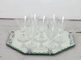 A beautiful set of 8 French etched champagne and wine glasses