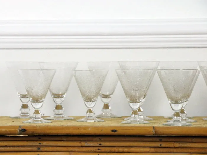 A beautiful set of 8 French etched champagne and wine glasses