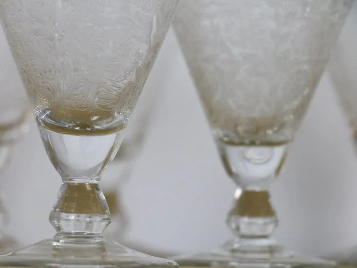 A beautiful set of 8 French etched champagne and wine glasses