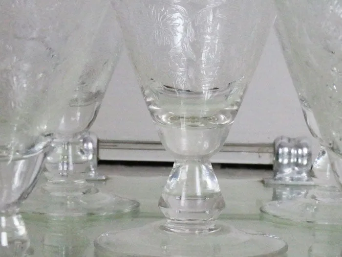 A beautiful set of 8 French etched champagne and wine glasses